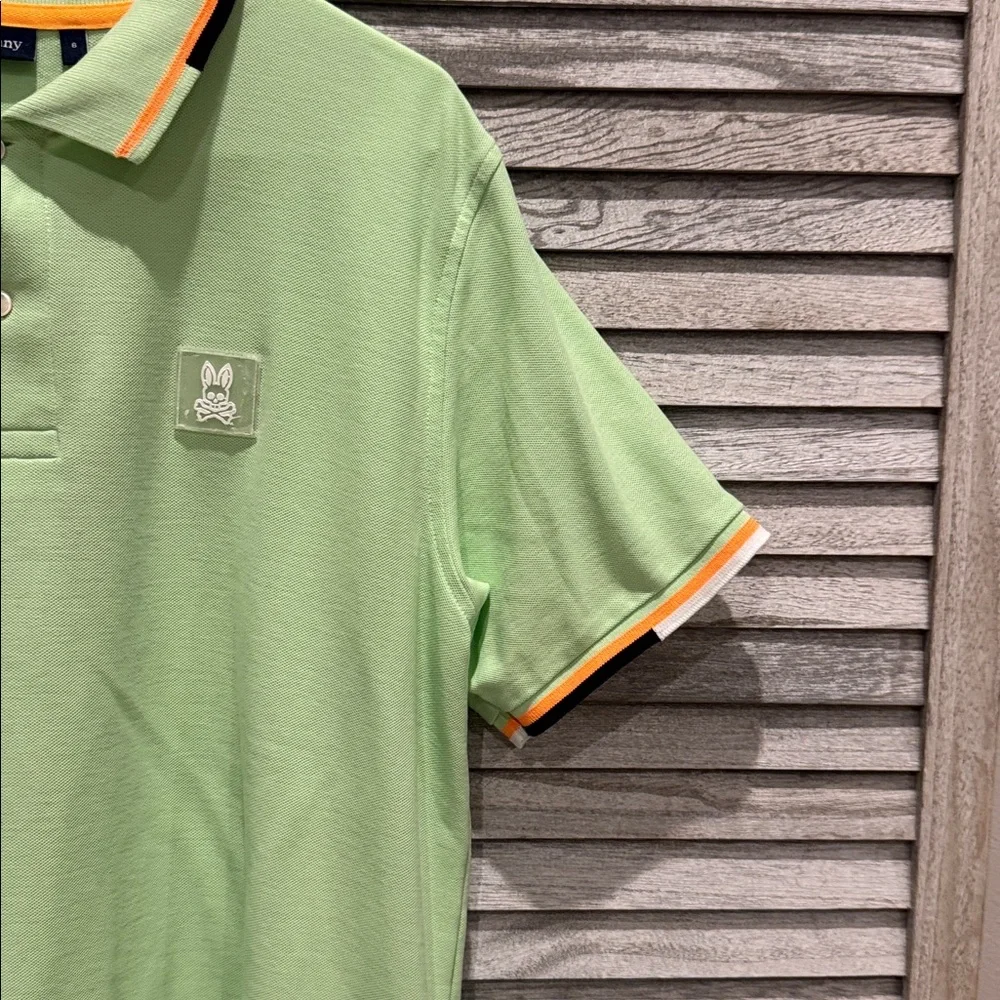 118. Psycho Bunny Light Green men’s Polo with Orange Accents, pre owned size. 6